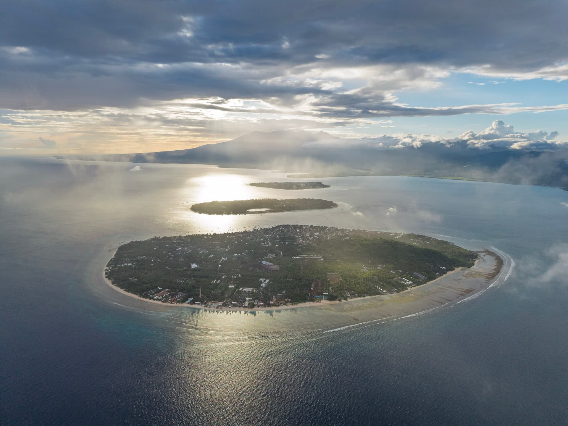 Aerial view of Gili Trawangan, with Gili Meno and Gili Air behind in low sun